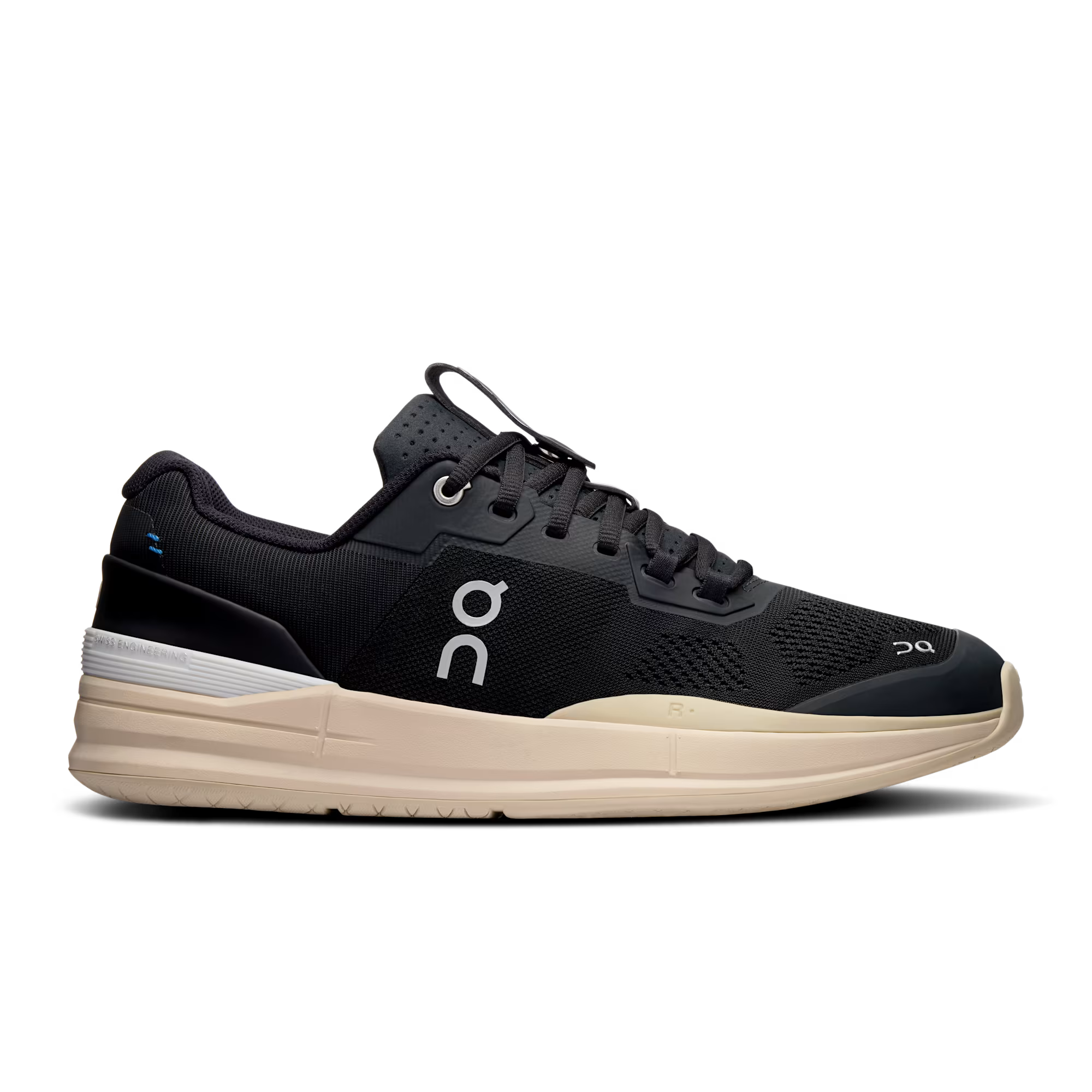 Side view on white background of Mens On The Roger Pro running shoe in Black/Sand, Medium (Regular) width