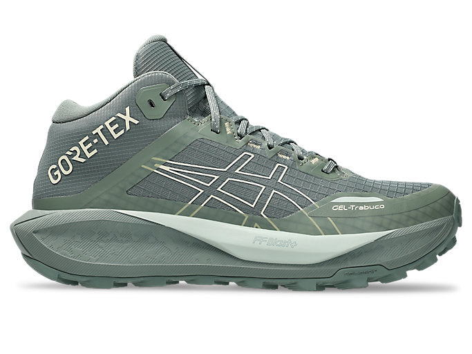 Side view on white background of Mens Asics Gel-Trabuco MT GTX running shoe in Monument Blue/Vanilla, Medium (Regular) width