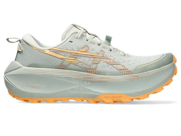 Side view on white background of Womens Asics Trabuco Max 4 running shoe in Cream/Dusty Steppe, Medium (Regular) width