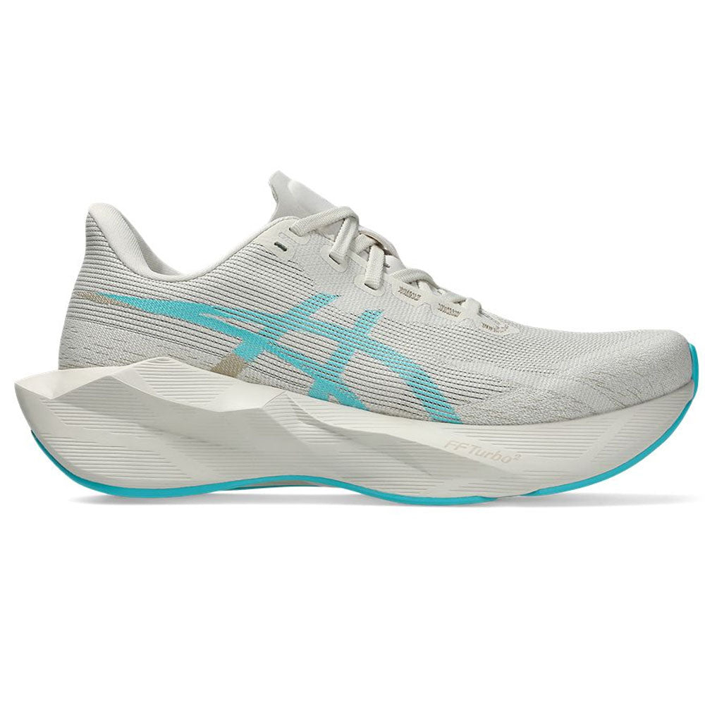 Side view on white background of Womens Asics Novablast running shoe in Soft Oat/Energy Aqua, Medium (Regular) width
