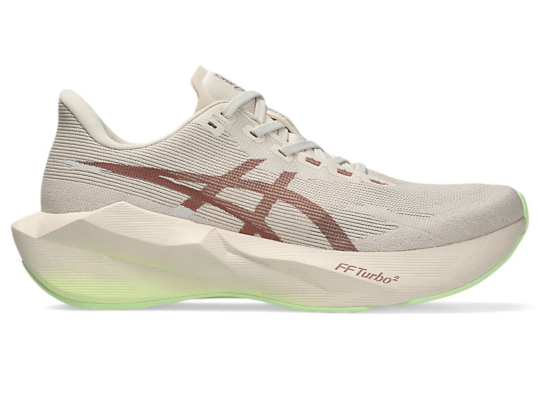 Side view on white background of Womens Asics Novablast 6 running shoe in Rose Dust/Illuminate Yellow, Wide width