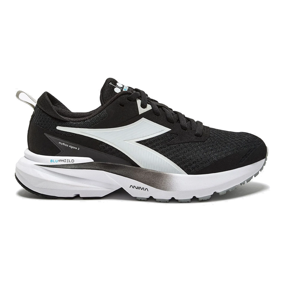 Side view on white background of Womens Diadora Mythos Blushield Vigore 3 running shoe in Black/White, Medium (Regular) width