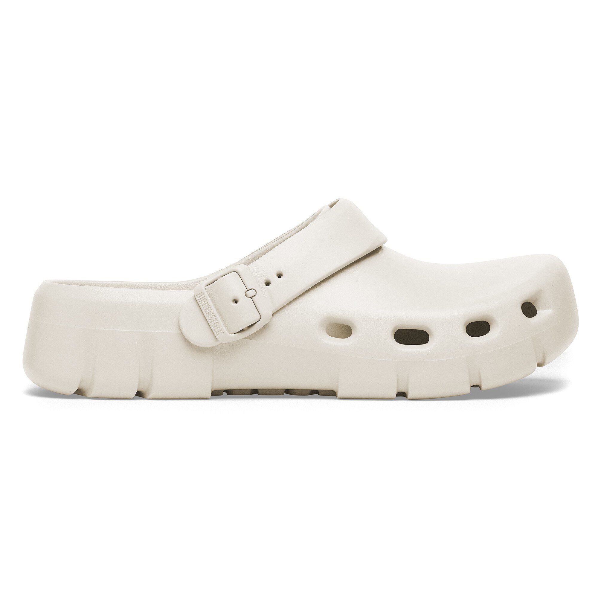 Side view on white background of Womens Birkenstock Birki Flow EVA running shoe in Eggshell, Medium (Regular) width
