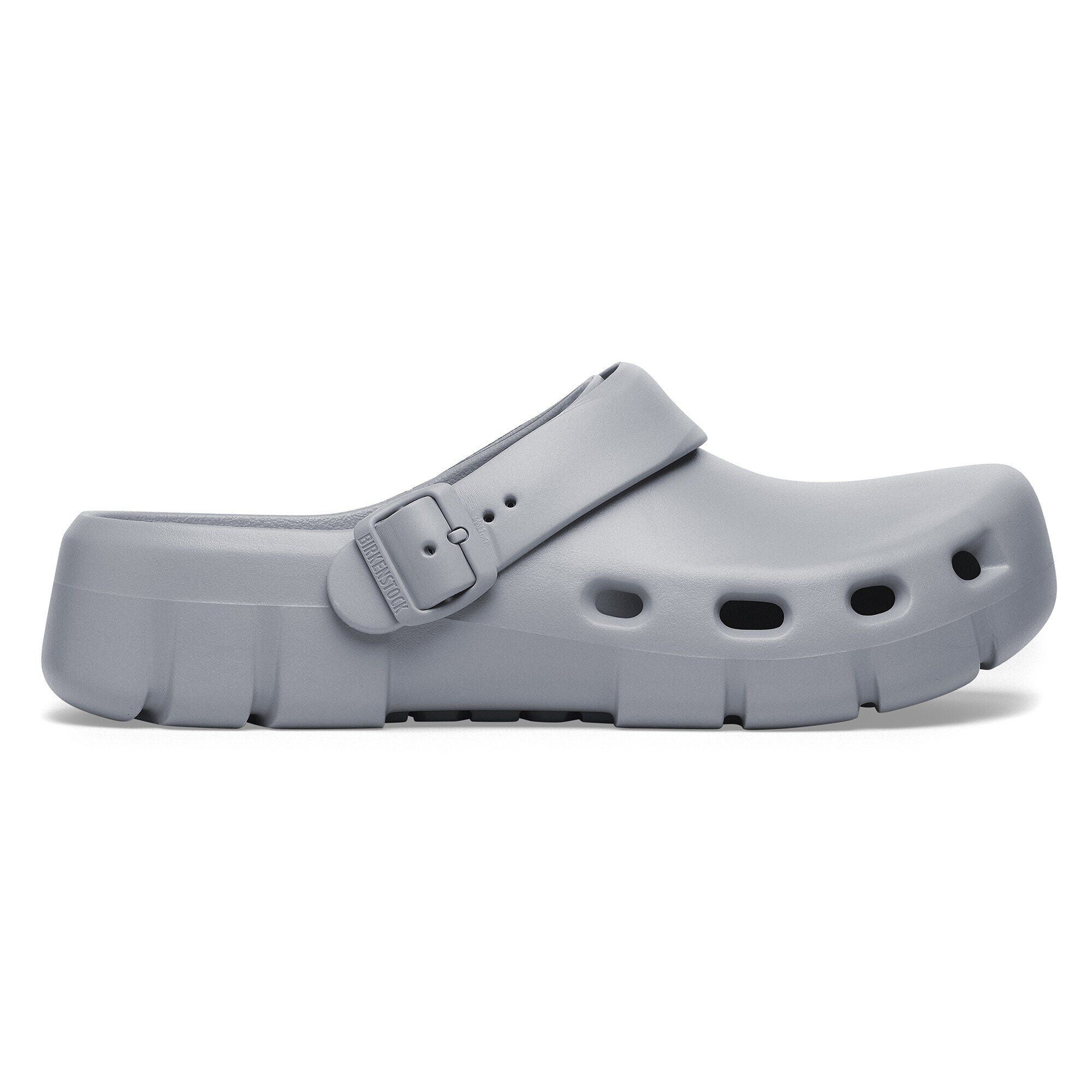 Side view on white background of Mens Birkenstock Birki Flow running shoe in Stone Coin, Medium (Regular) width
