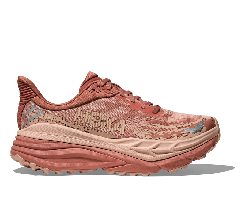 Side view on white background of Womens Hoka Stinson 7 running shoe in Blush/Rose Latte, Medium (Regular) width