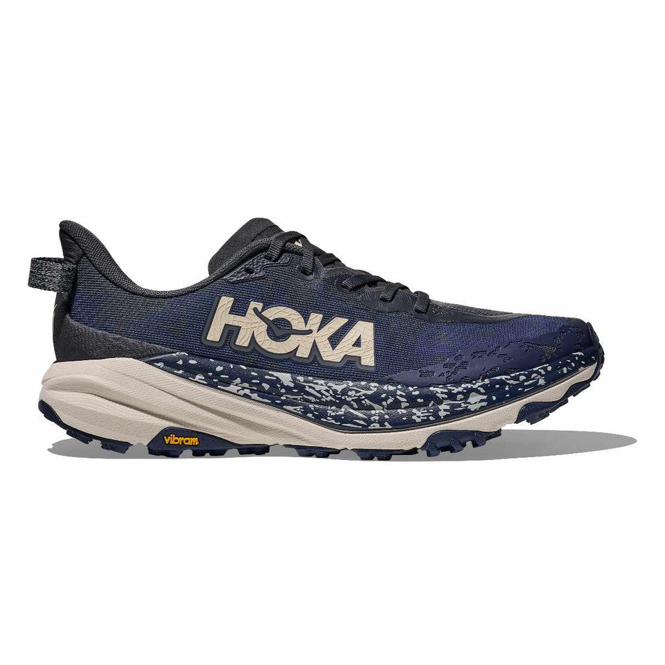 Side view on white background of Mens Hoka Speedgoat 6 running shoe in Charcoal Grey/Midnight Blue, Wide width