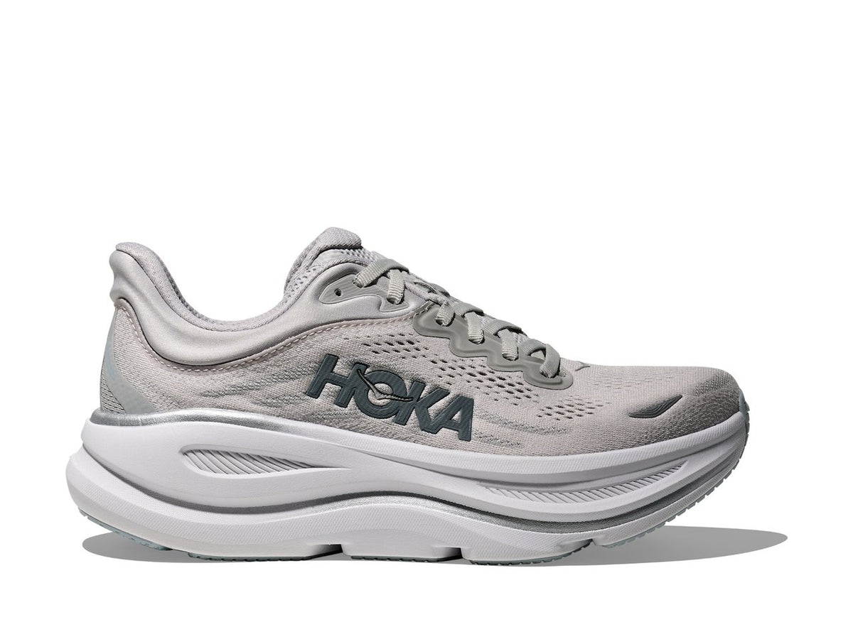 Side view on white background of Womens Hoka Bondi 9 running shoe in Stardust/Mineral Blue, Medium (Regular) width