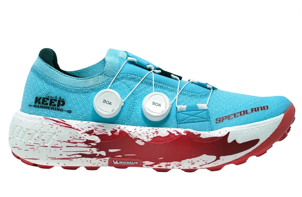 Side view on white background of Unisex Speedland GS:PGH running shoe in Blue/Red, Medium (Regular) width