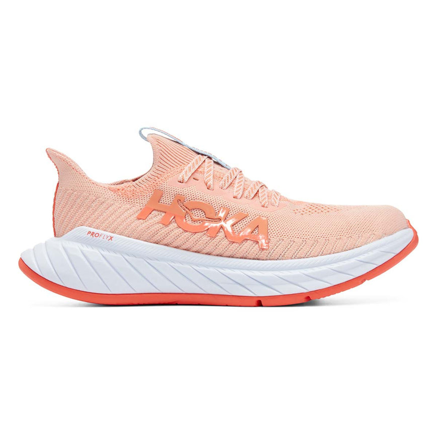 Side view on white background of Womens Hoka Carbon X 3 running shoe in Peach Parfait/Summer Song, Medium (Regular) width