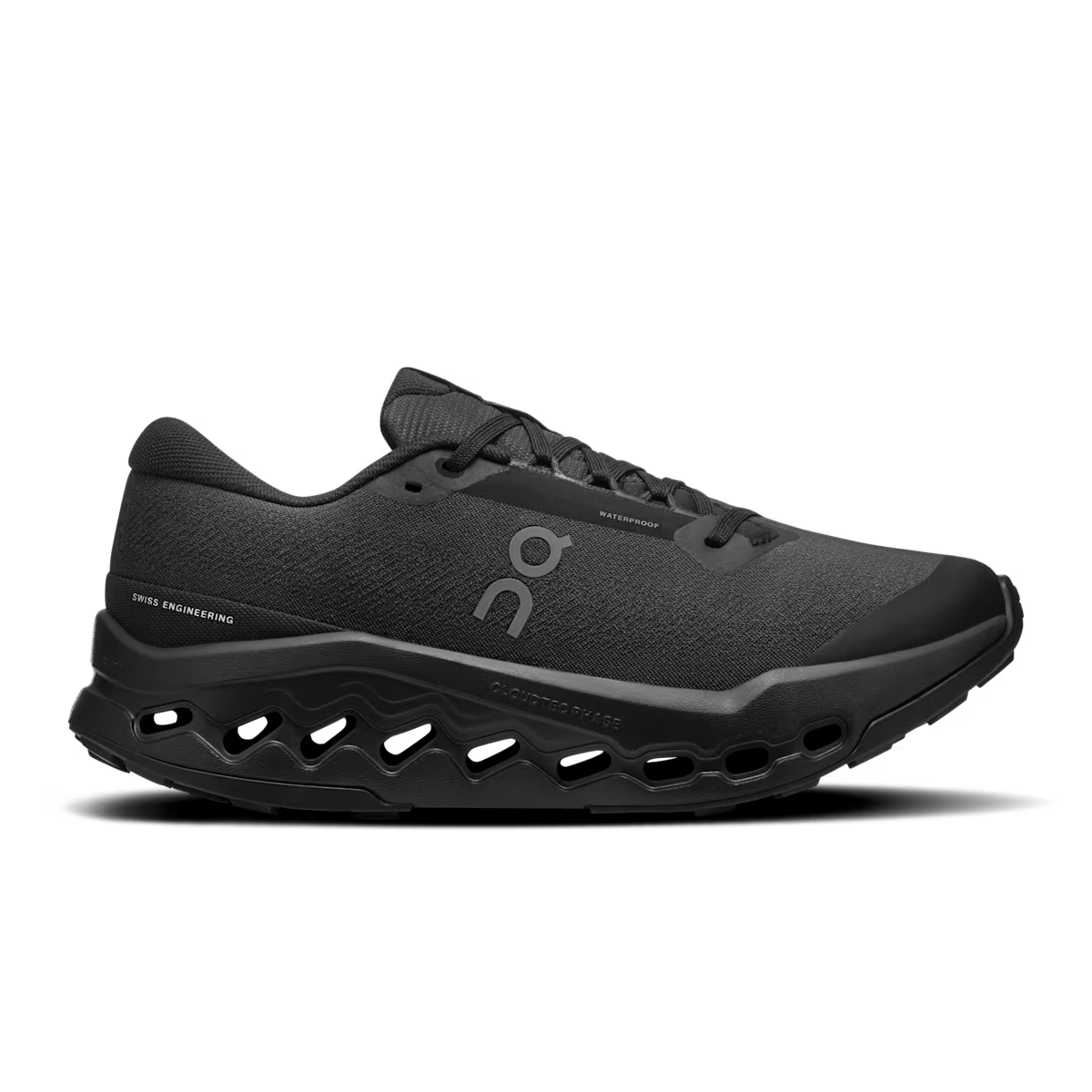 Side view on white background of Womens On Cloudsurfer Trail 2 Waterproof running shoe in Black/Black, Medium (Regular) width