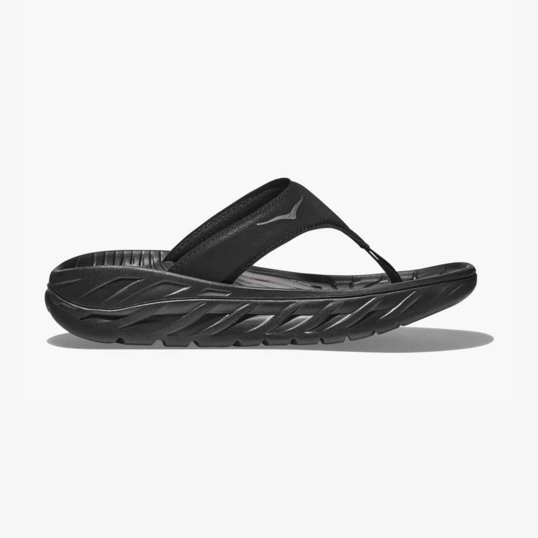 Side view on white background of Womens Hoka Ora Recovery Flip running shoe in Black/Dark Gull Gray, Medium (Regular) width