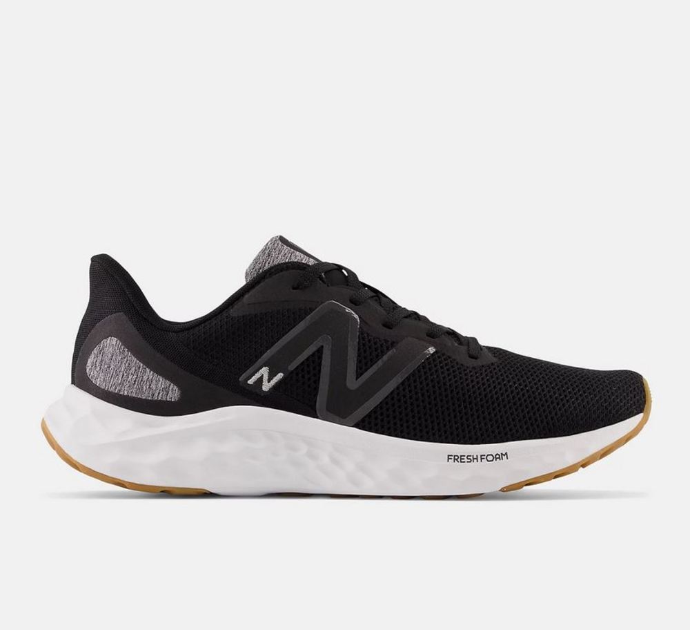 Side view on white background of Mens New Balance Fresh Foam Arishi v4 running shoe in Black/Grey/Beige, Medium (Regular) width
