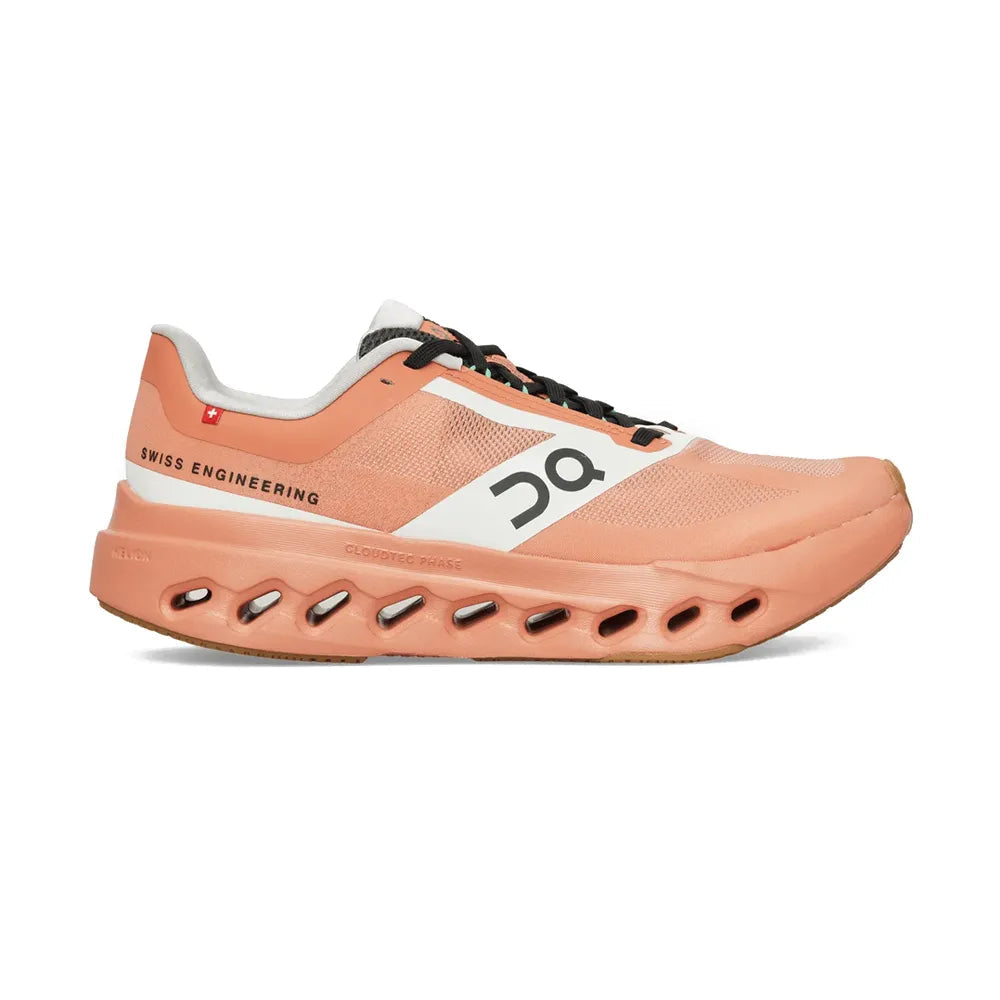 Side view on white background of Womens On Cloudsurfer Next Z5 running shoe in Canyon/White, Medium (Regular) width