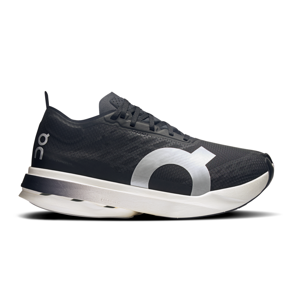Side view on white background of Womens On Cloudboom Strike running shoe in Black/White, Medium (Regular) width