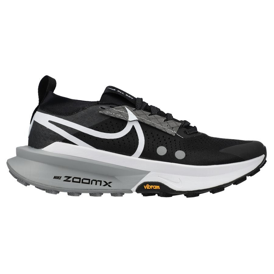 Side view on white background of Womens Nike ZoomX Zegama Trail 2 running shoe in Black/White-Wolf Grey, Medium (Regular) width