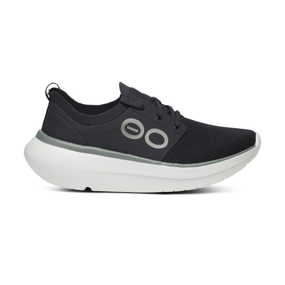 Side view on white background of Mens OOFOS OOmy Stride running shoe in White/Black, Medium (Regular) width