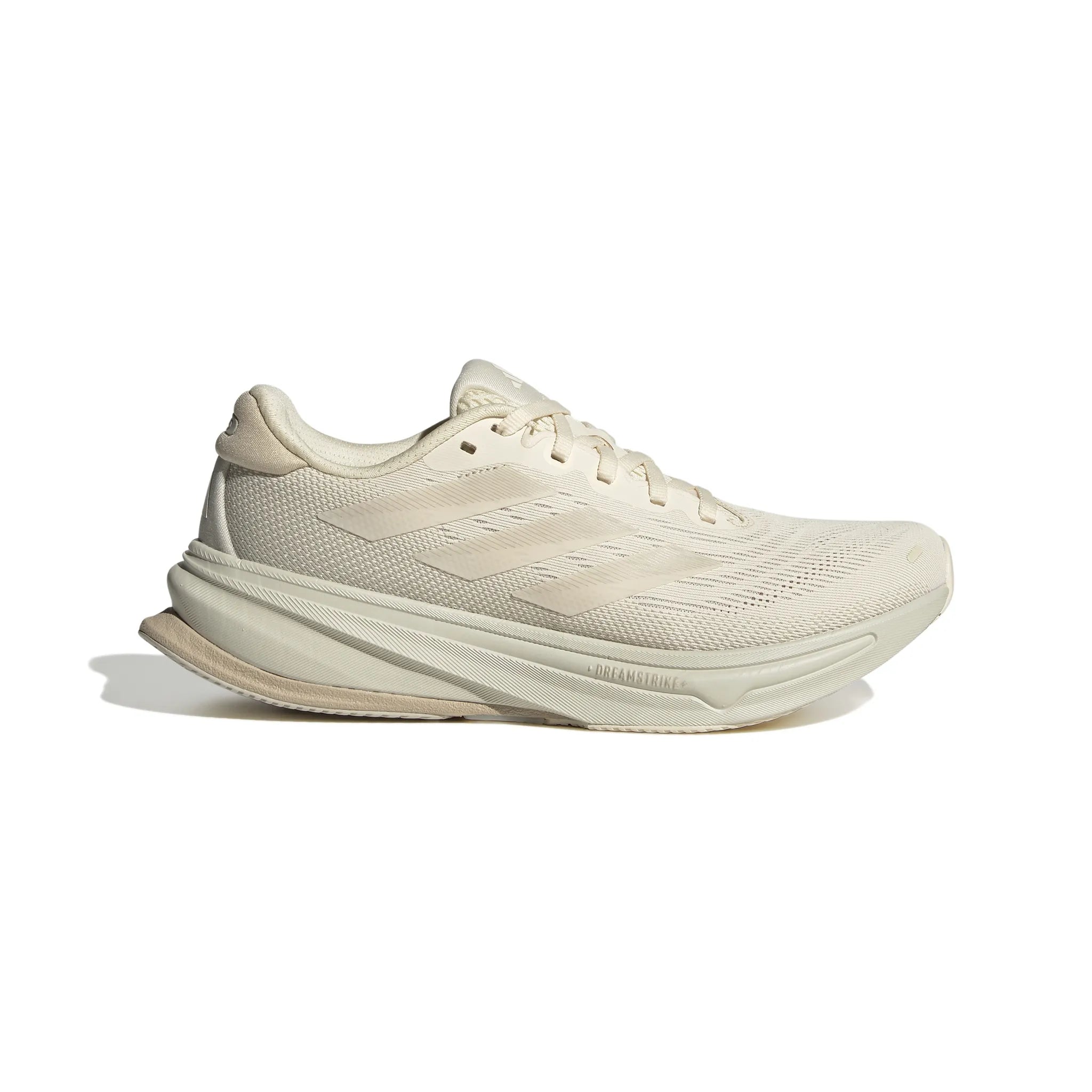 Side view on white background of Womens Adidas Supernova Rise 2 running shoe in Wonder White/Wonder Beige, Medium (Regular) width