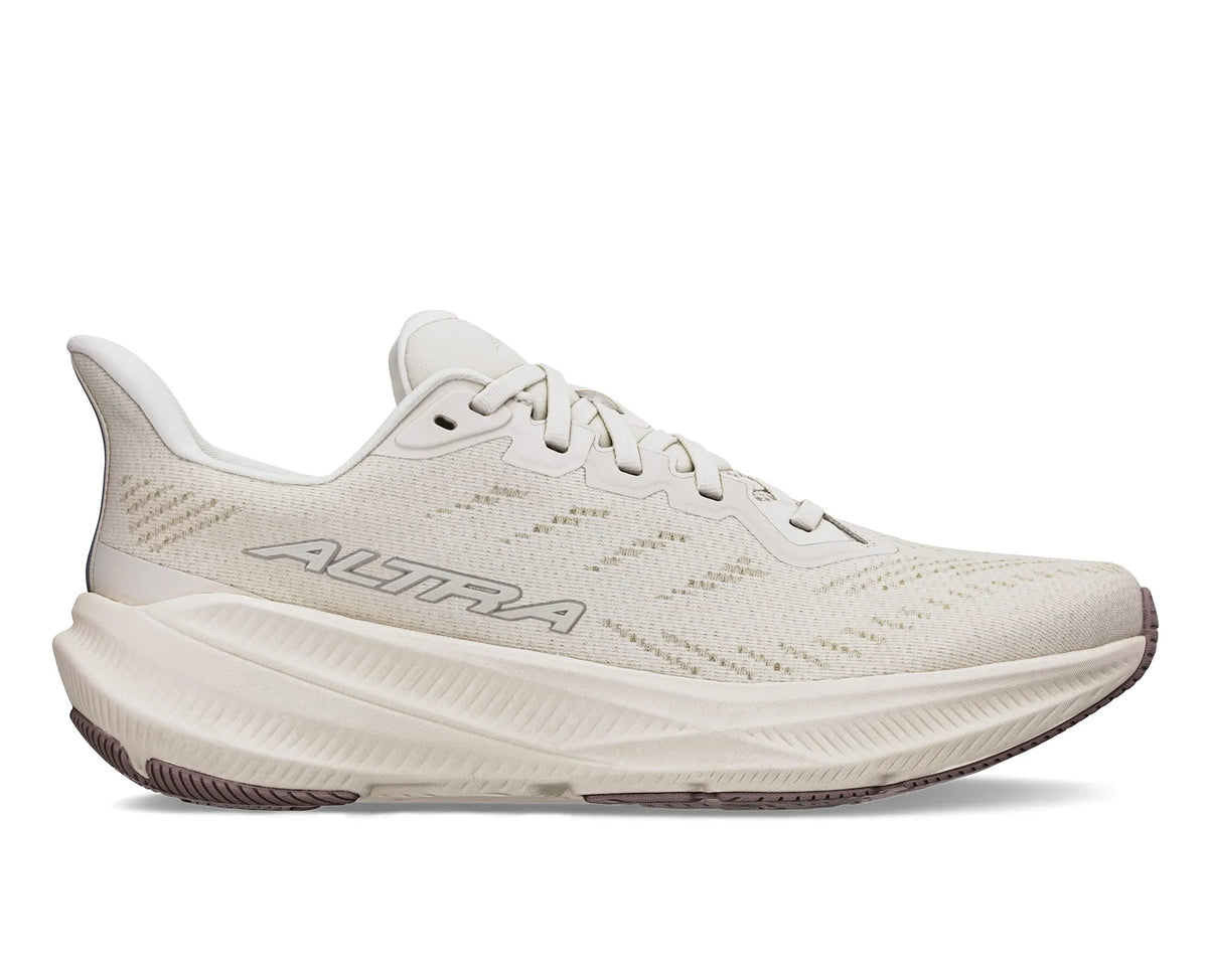 Side view on white background of Womens Altra Experience Flow running shoe in Sand, Medium (Regular) width