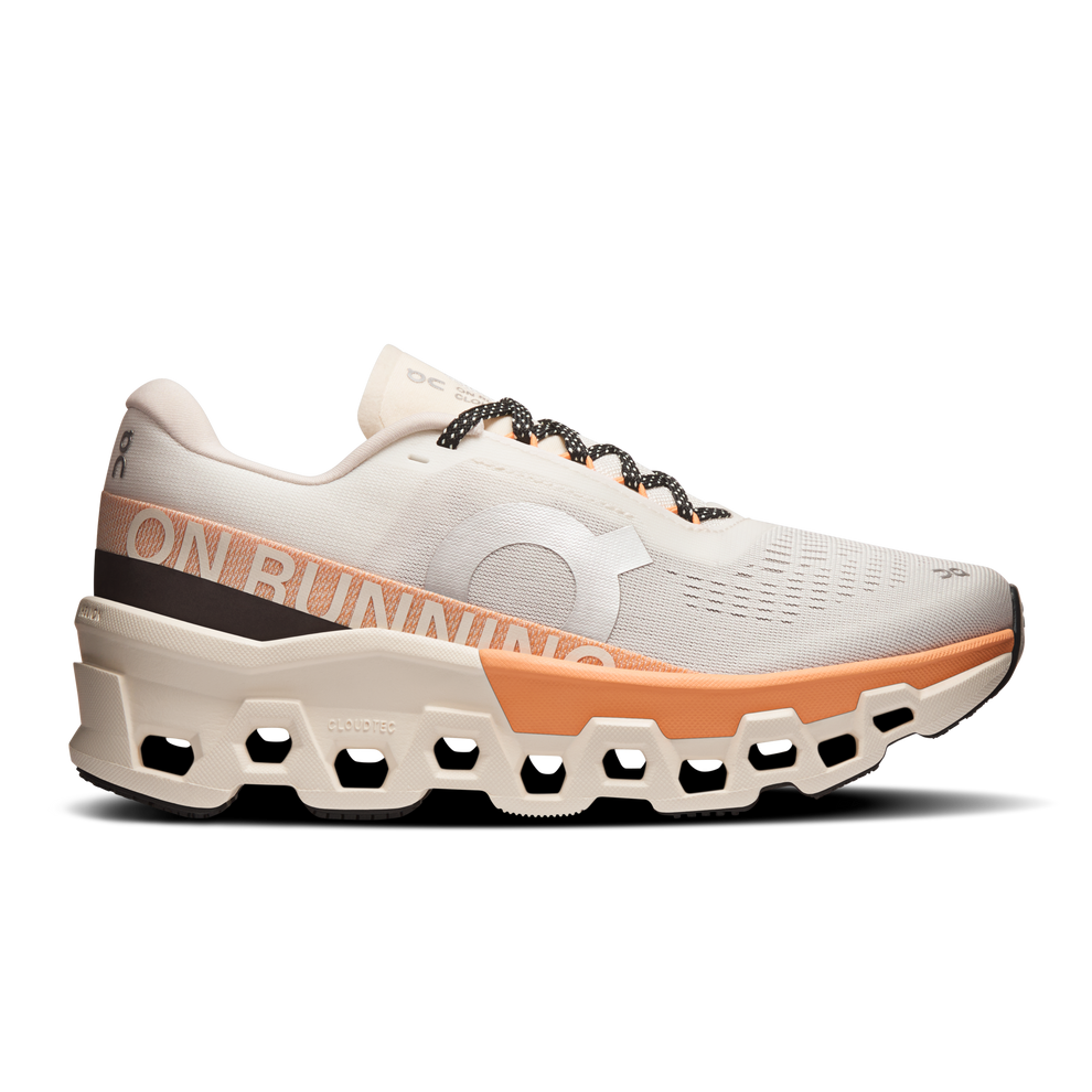 Side view on white background of Womens On Cloudmonster 2 running shoe in Ivory/Tangerine, Medium (Regular) width