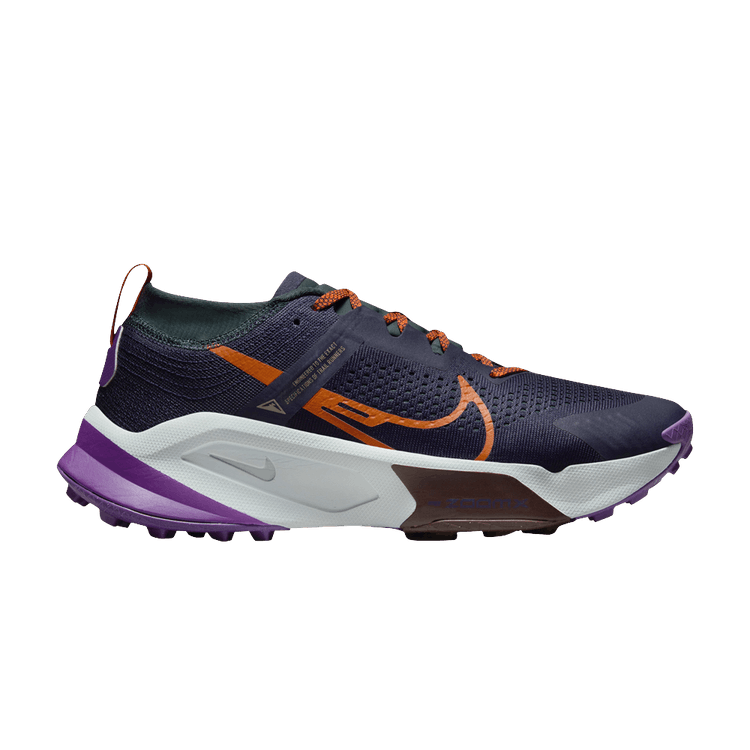 Side view on white background of Mens Nike ZoomX Zegama Trail running shoe in Purple Ink/Safety Orange, Medium (Regular) width