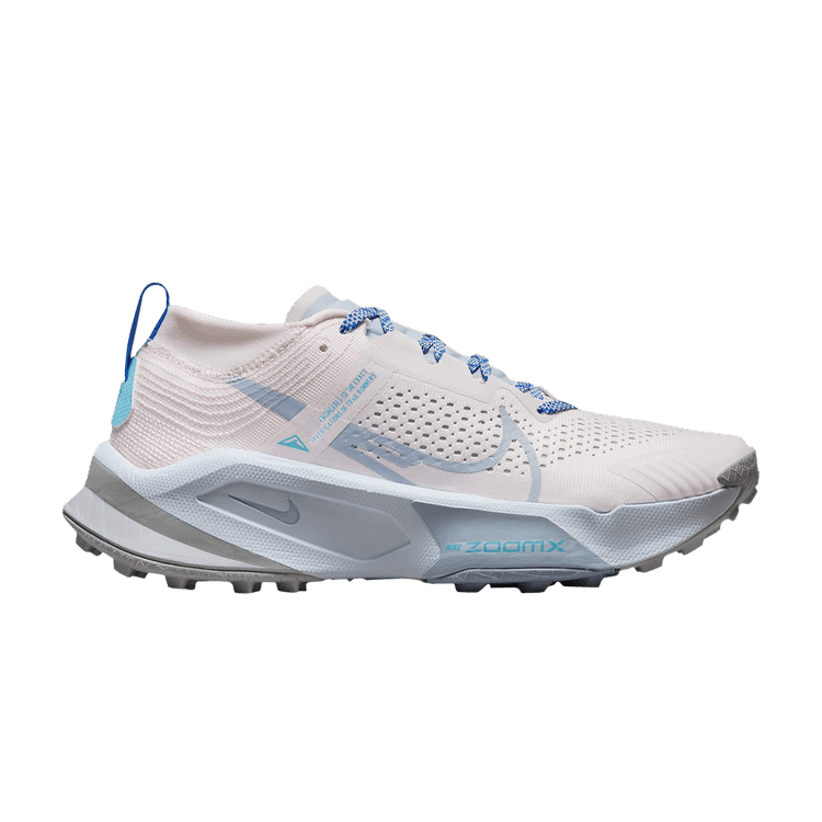 Side view on white background of Womens Nike ZoomX Zegama Trail running shoe in Pearl Pink/Blue Whisper, Medium (Regular) width