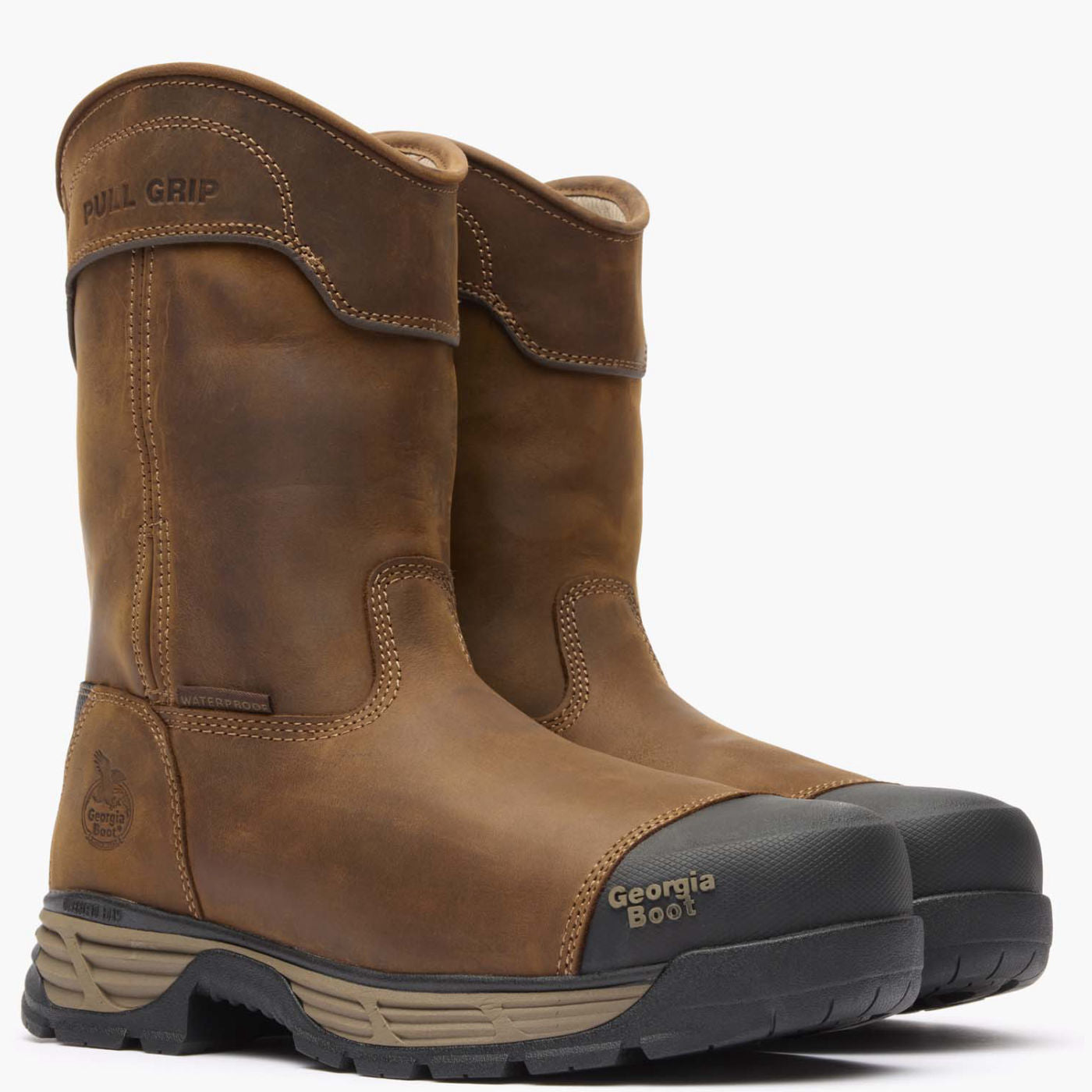 Front view of two brown boots showing pull straps and alloy safety toe.