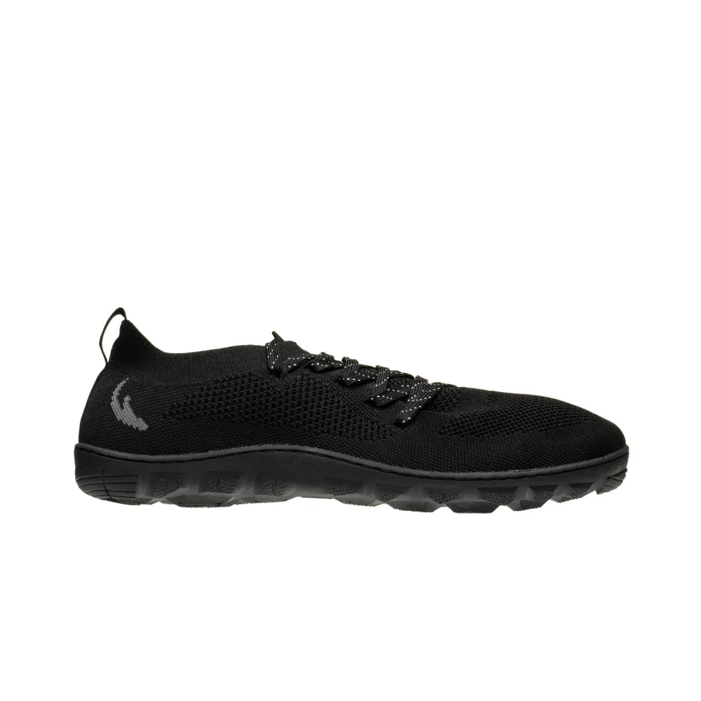 Side view on white background of Womens Freet Keld running shoe in Black, Medium (Regular) width