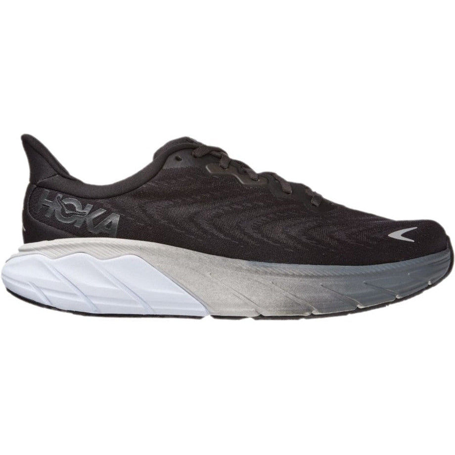 Side view on white background of Mens Hoka Arahi running shoe in Black/White, Medium (Regular) width
