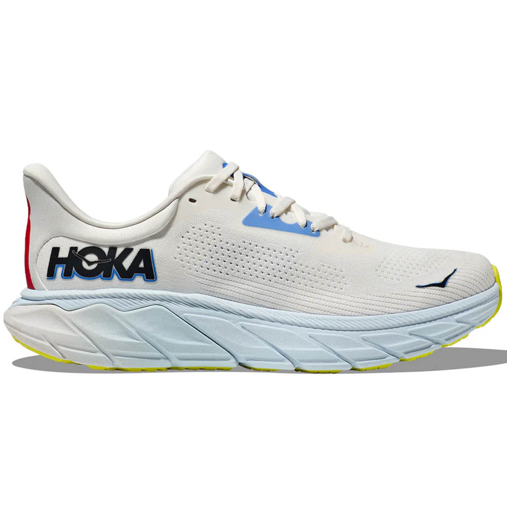 Side view on white background of Mens Hoka Arahi running shoe in Blanc De Blanc/Virtual Blue, Medium (Regular) width