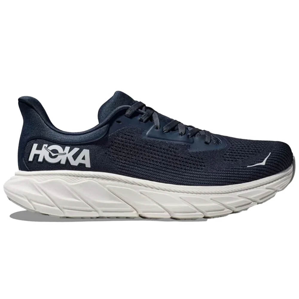 Side view on white background of Mens Hoka Arahi running shoe in Outer Space/White, Wide width