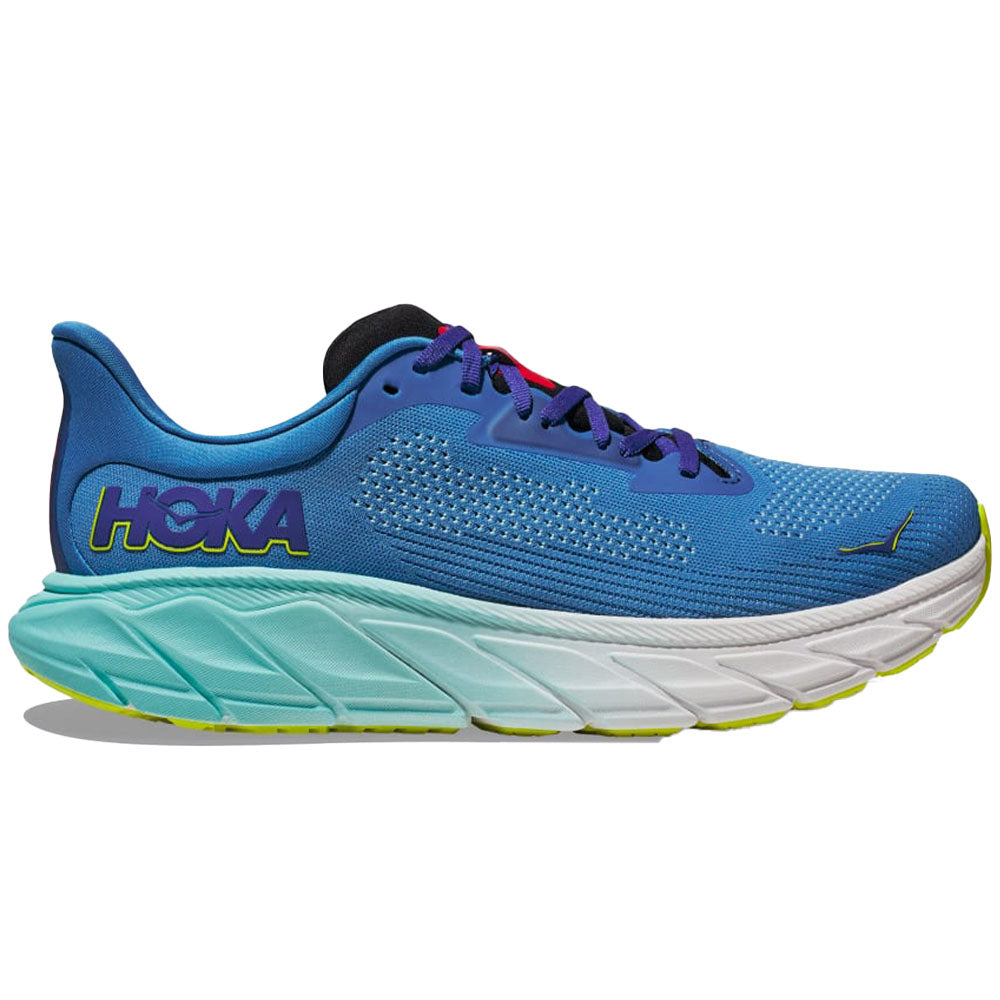 Side view on white background of Mens Hoka Arahi running shoe in Virtual Blue/Cerise, Medium (Regular) width