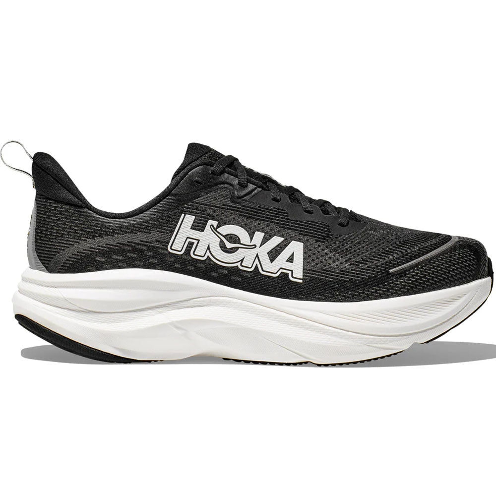 Side view on white background of Mens Hoka Skyflow running shoe in Black/White, Medium (Regular) width