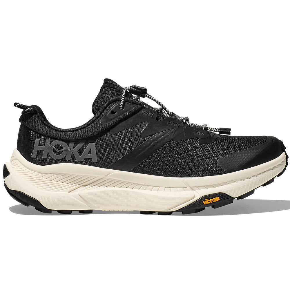 Side view on white background of Mens Hoka Transport running shoe in Black/Alabaster, Medium (Regular) width