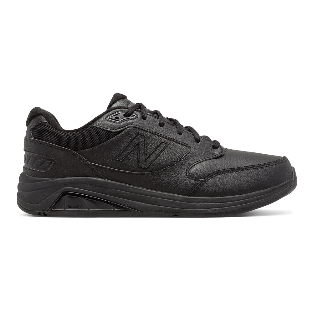 Side view on white background of Mens New Balance 928 running shoe in Black, Wide width