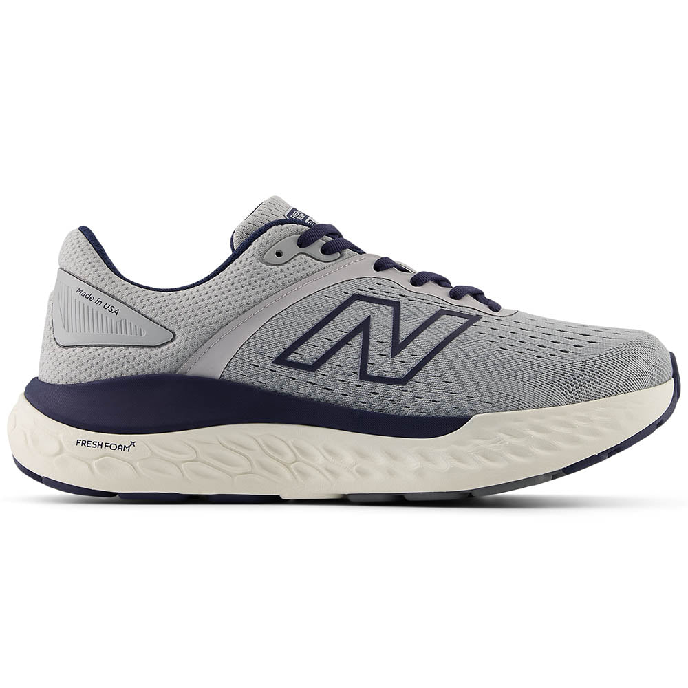 Side view on white background of Mens New Balance Fresh Foam 1540 running shoe in Aluminum Grey/NB Navy, Wide width