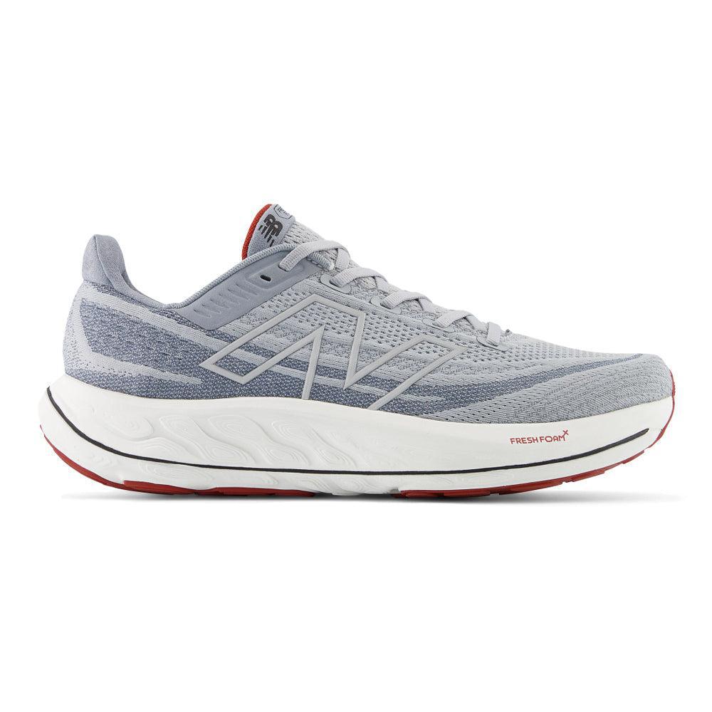 Side view on white background of Mens New Balance Fresh Foam Vongo running shoe in Aluminum Grey/Brick Red, Medium (Regular) width
