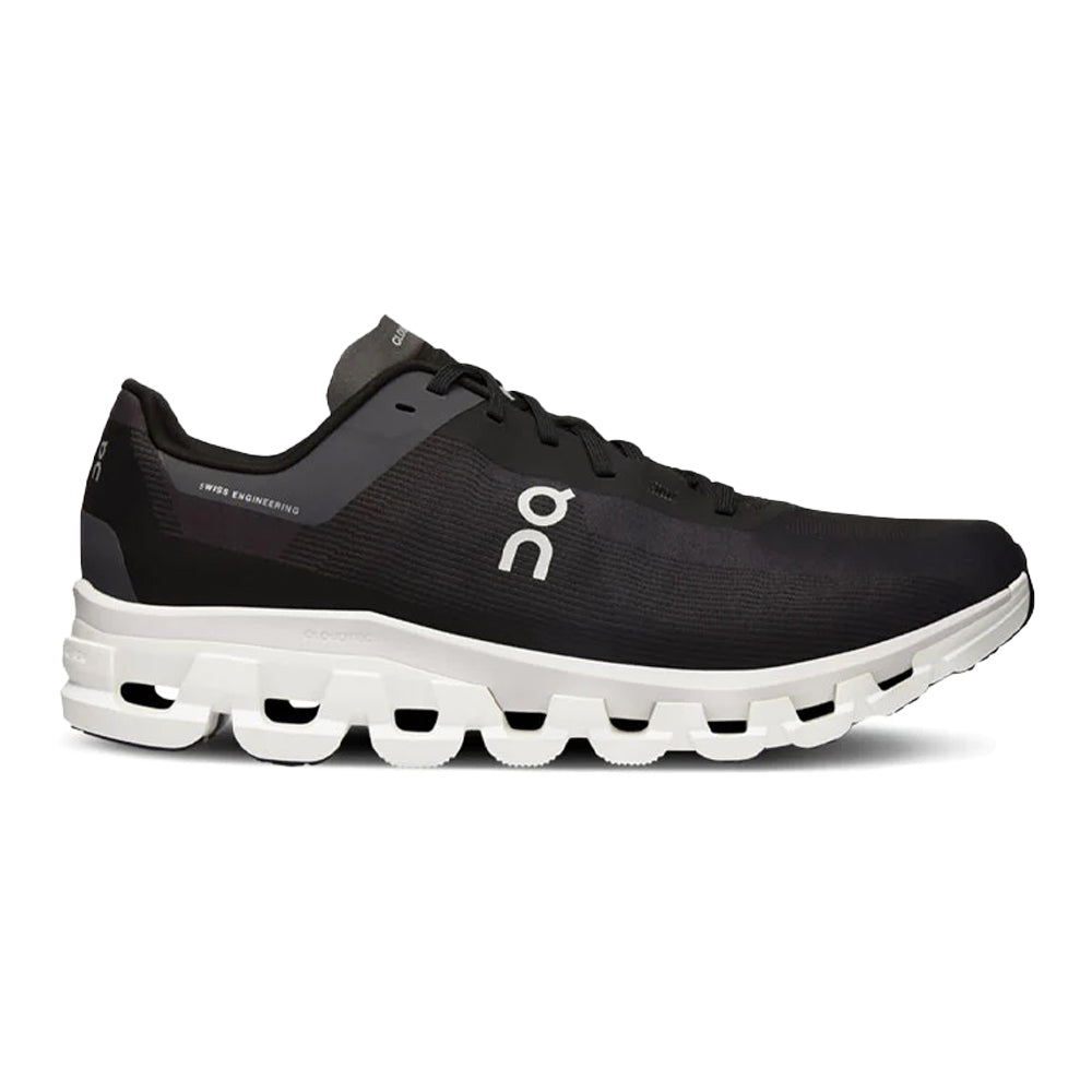 Side view on white background of Mens On Cloudflow running shoe in Black/White, Medium (Regular) width
