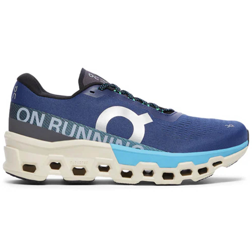 Side view on white background of Mens On Cloudmonster running shoe in Tempest/Horizon, Medium (Regular) width