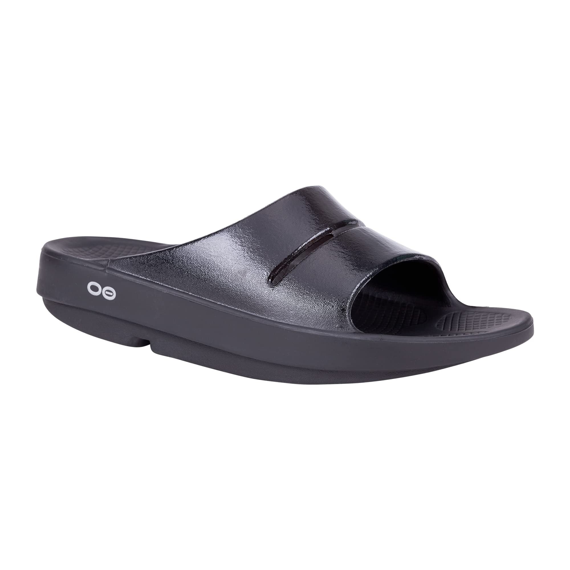 Side view on white background of Womens OOFOS OOahh Luxe Slide running shoe in Black, Medium (Regular) width