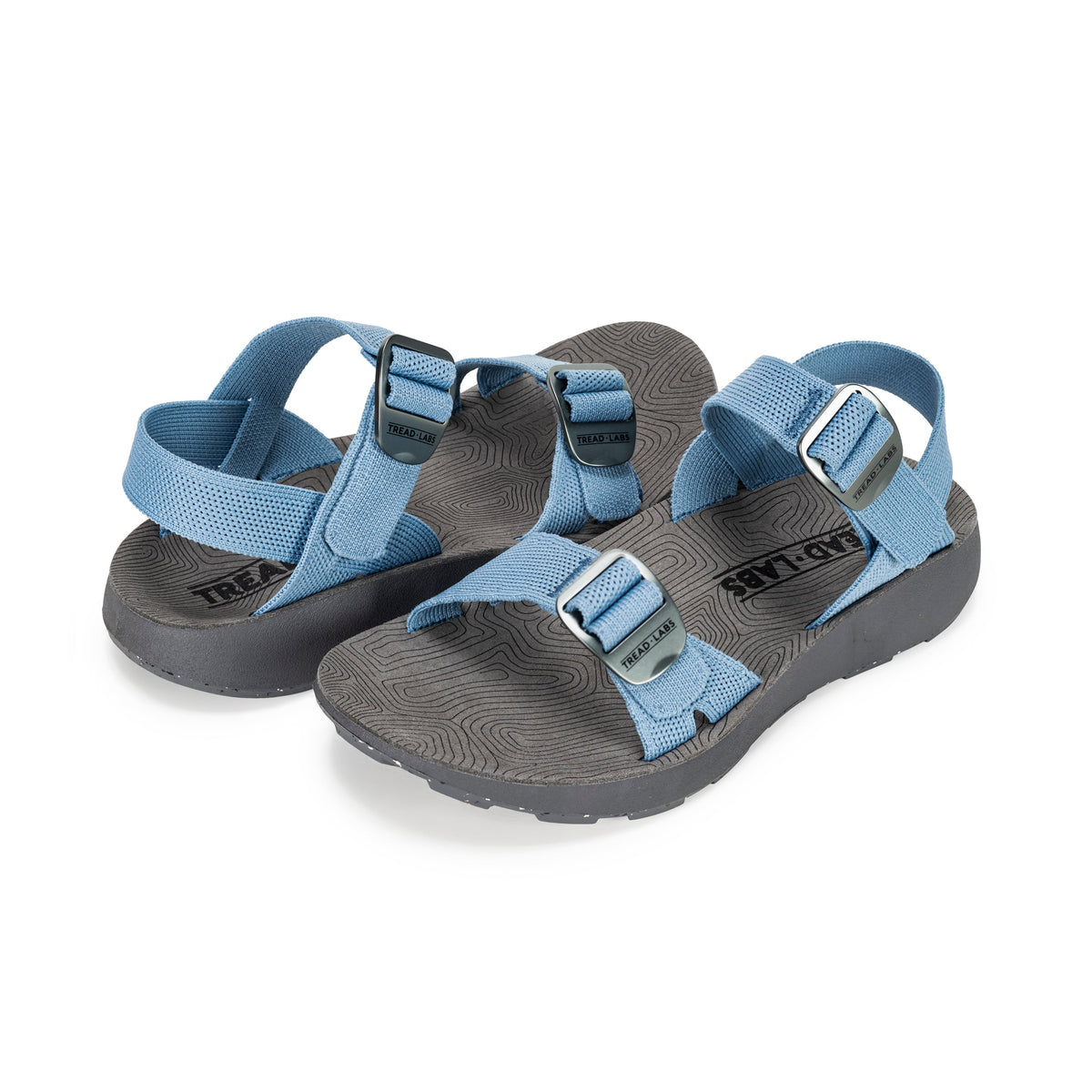 Overhead flat lay of Tread Labs Salinas Slide women's sandal in Sky blue showing adjustable strap buckles and arch support insole