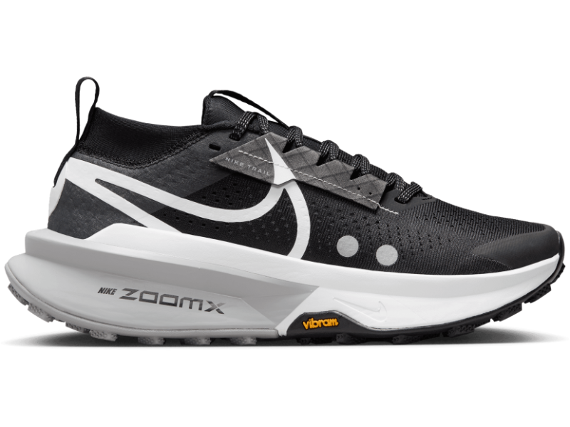 Side view on white background of Womens Nike ZoomX Zegama Trail 2 running shoe in Armory Navy/Sail-Green Frost, Medium (Regular) width