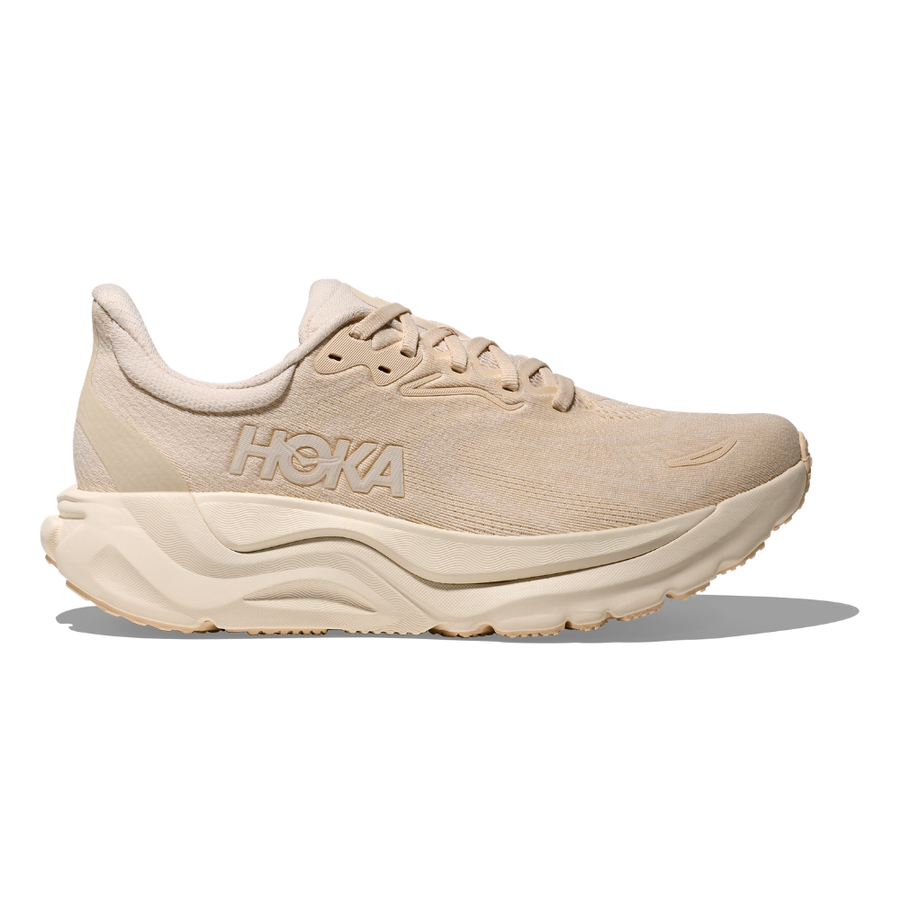 Side view on white background of Womens Hoka Arahi 8 running shoe in Birch/Alabaster, Wide width