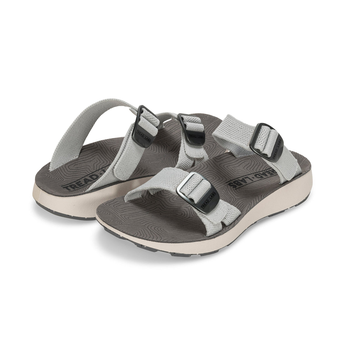 Pair of Tread Labs Salinas Slide women's arch support sandals in Mirage grey, angled view showing double-buckle adjustable straps