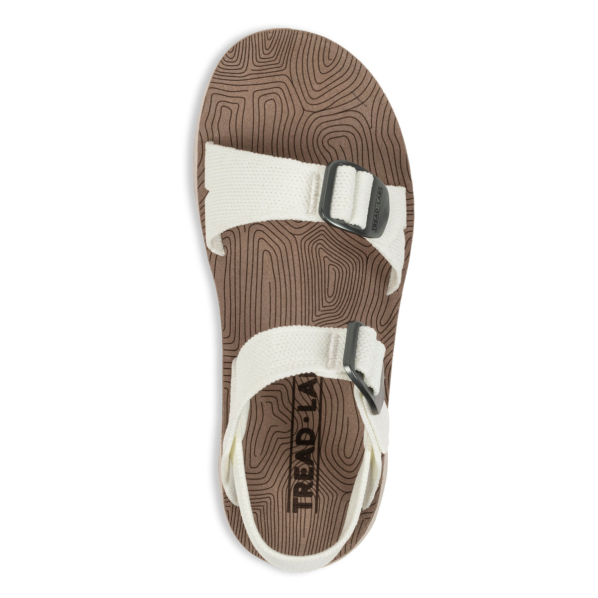 Overhead flat lay of Tread Labs Salinas Slide women's sandal in Coconut white showing adjustable strap buckles and arch support insole
