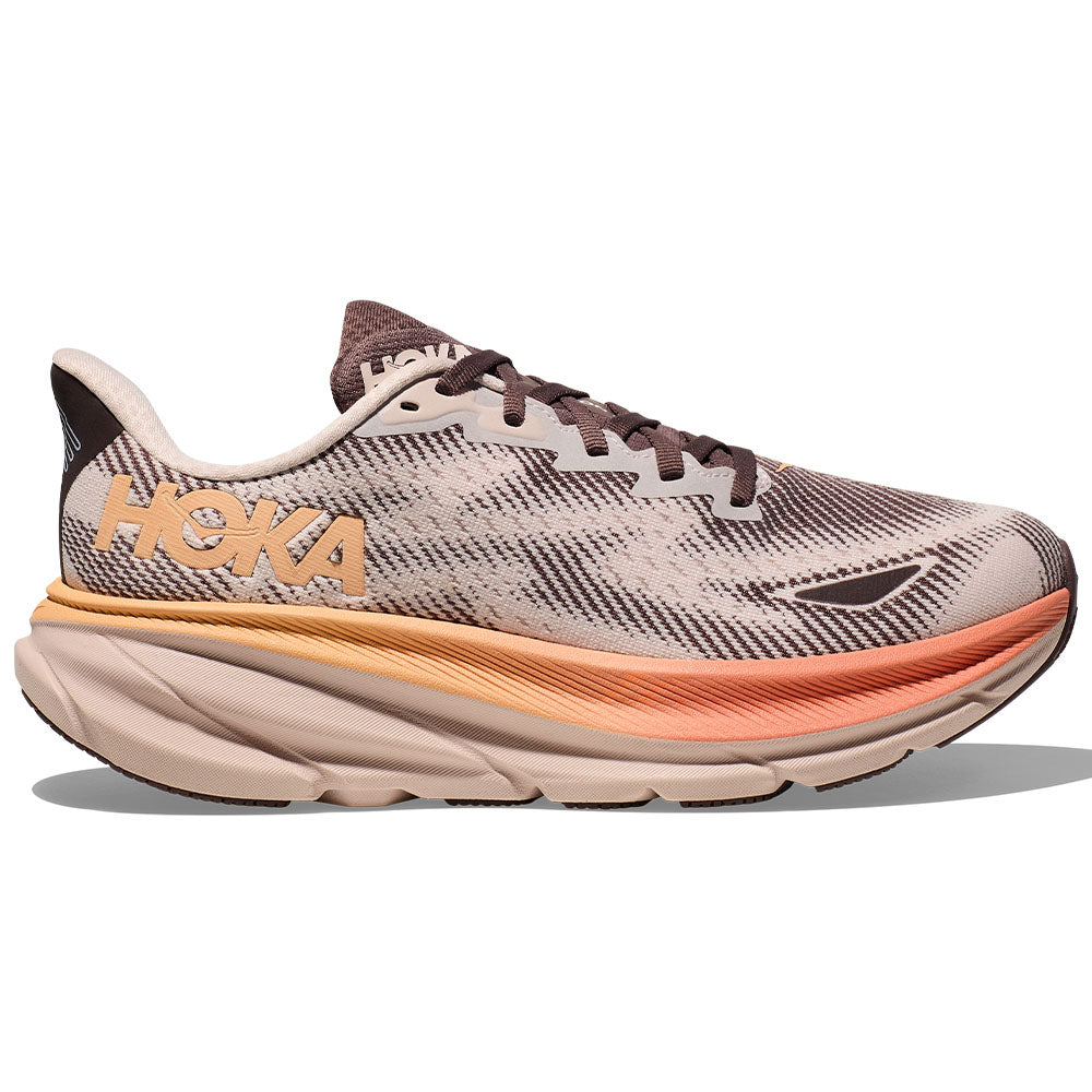 Side view on white background of Womens Hoka Clifton running shoe in Cosmic Pearl/Smoky Quartz, Medium (Regular) width