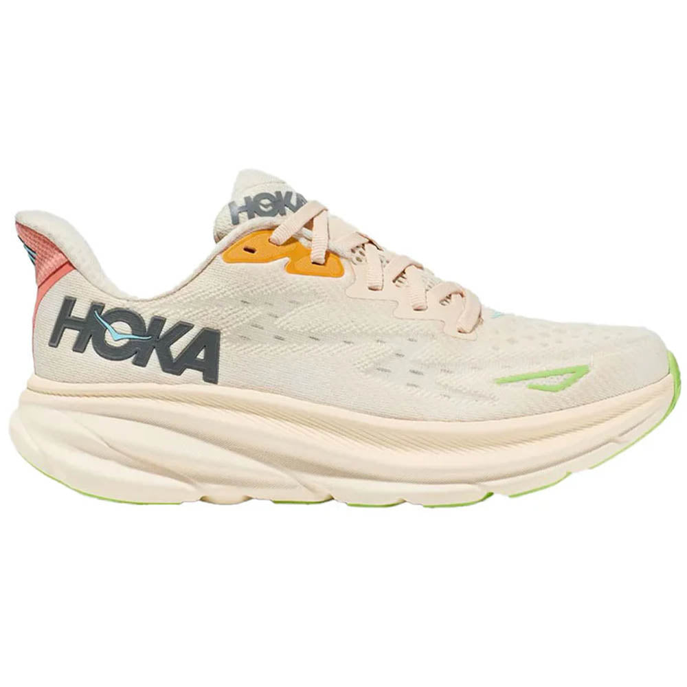 Side view on white background of Womens Hoka Clifton running shoe in Vanilla/Astral, Medium (Regular) width