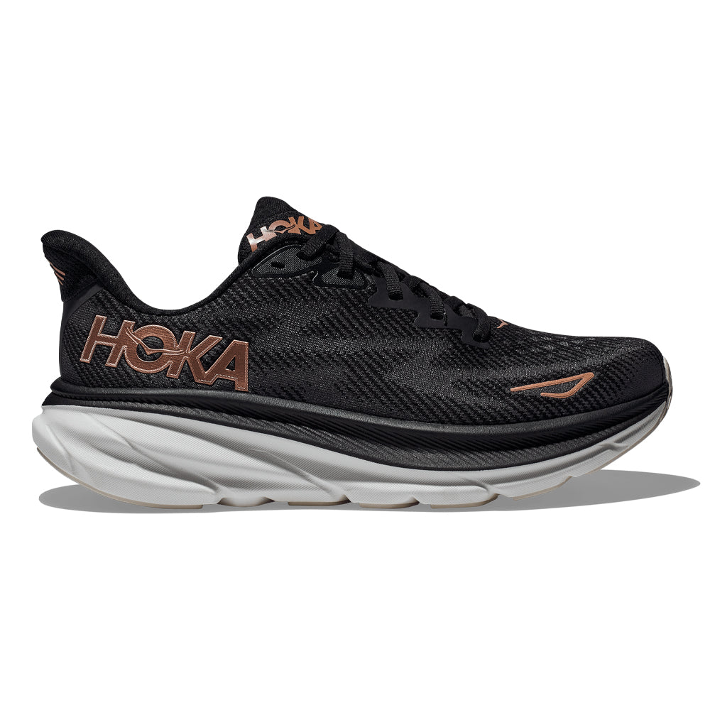 Side view on white background of Womens Hoka Clifton 9 running shoe in Black/Rose Gold, Medium (Regular) width