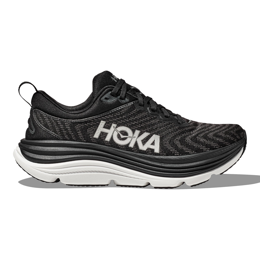 Side view on white background of Womens Hoka Gaviota running shoe in Black/White, Wide width