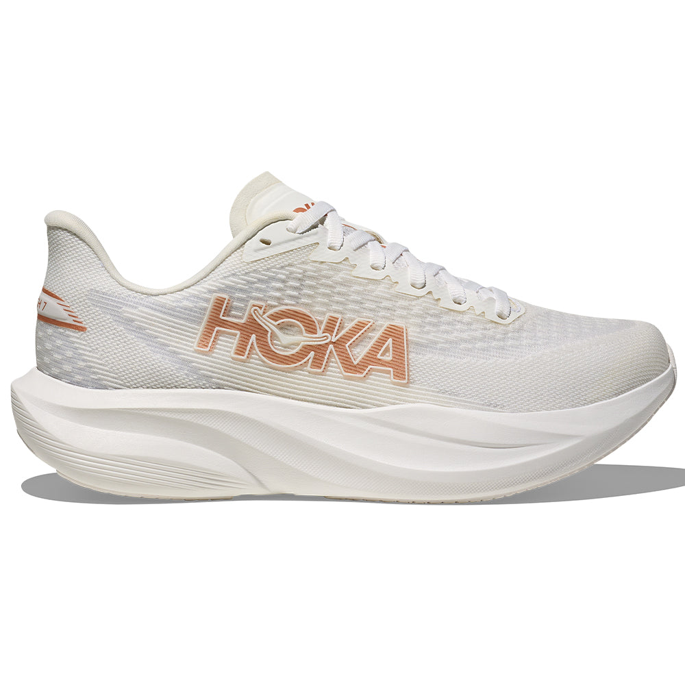 Side view on white background of Womens Hoka Mach running shoe in Frost/Rose Gold, Medium (Regular) width