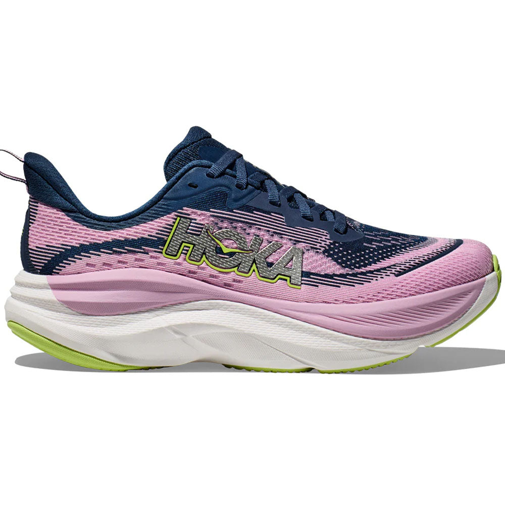 Side view on white background of Womens Hoka Skyflow running shoe in Midnight/Pink Twilight, Wide width